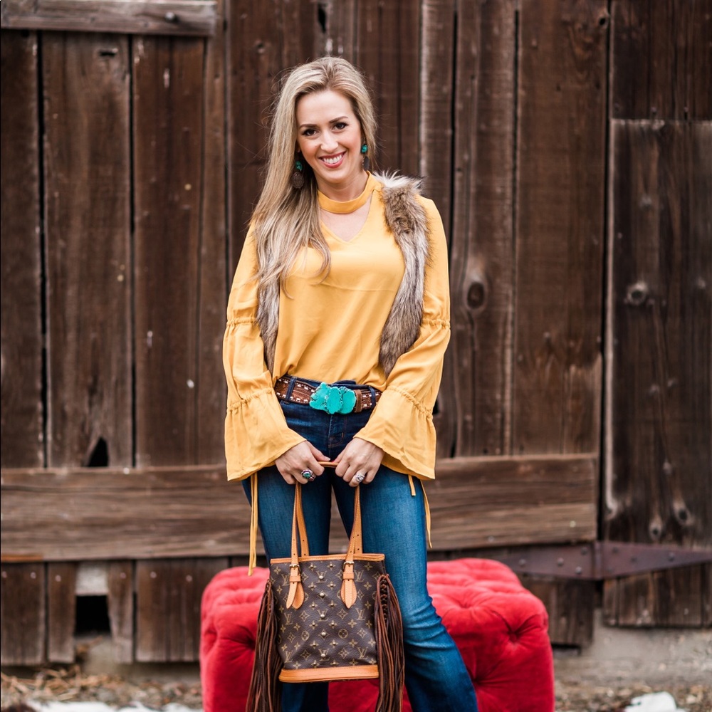Yellow mustard colored blouse.